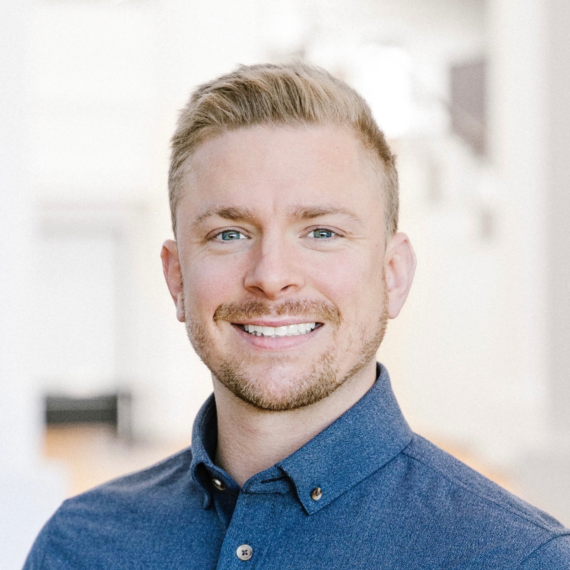 Professional headshot of CJ Norman